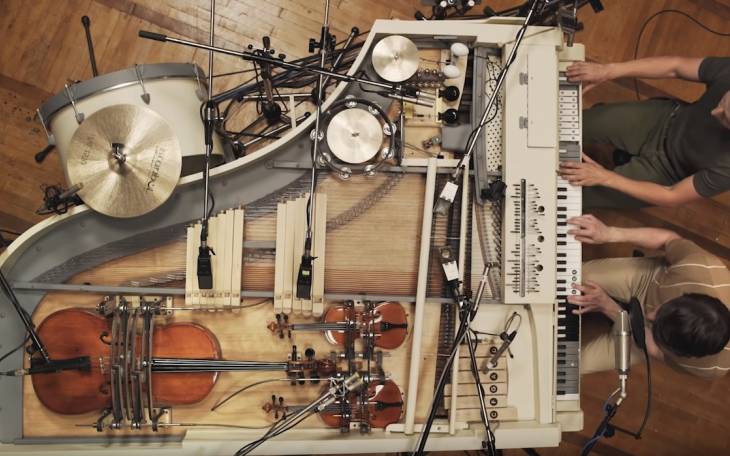 A Broken Vintage Piano Turned Into a Unique Analog Hybrid of 20 Instruments Connected to the Piano Keys